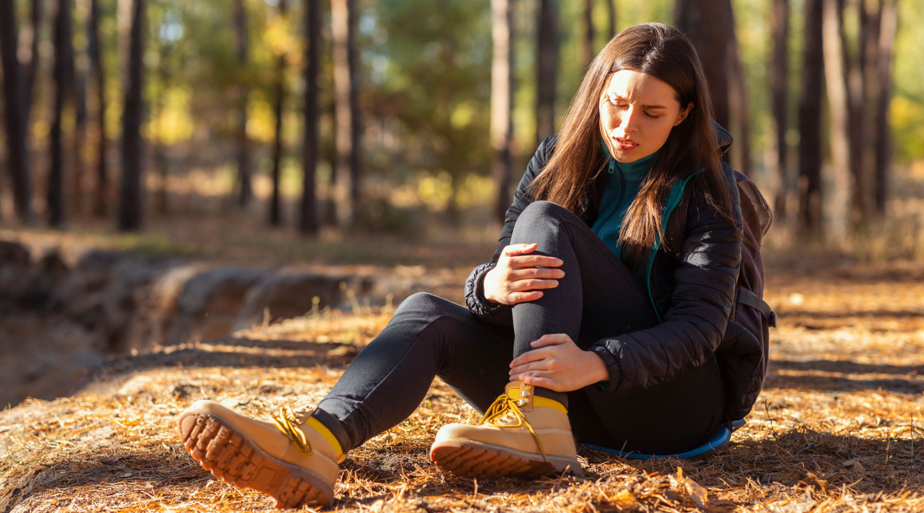 Woman suffers common hiking injury while on the trail.