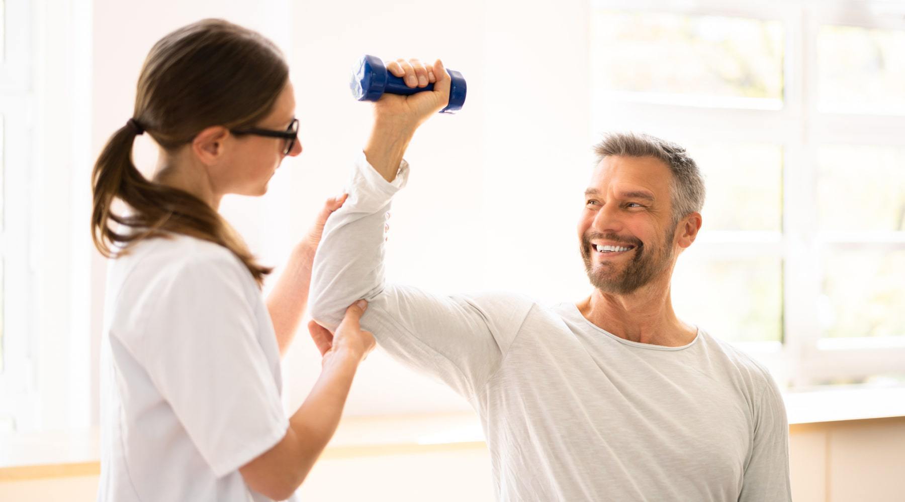 nh orthopedic trainer helping patient