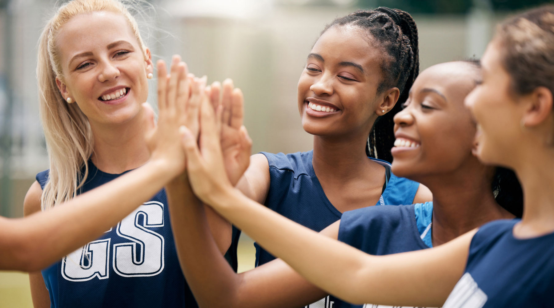 volleyball team high fiving